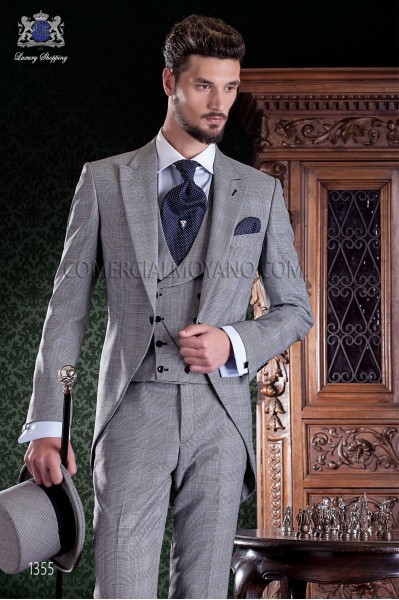 Chaqué de sastrería italiana de elegante corte “Slim”. Tejido Príncipe de Gales con fina raya azul.