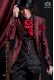  Groomswear Baroque. Suit coat in vintage red and black brocade fabric with mandarin collar. Pants in black satin.
