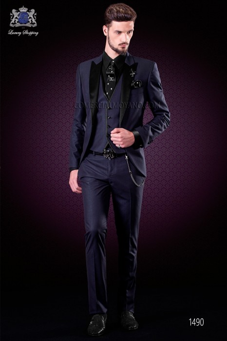 Italian costume with modern fashion boyfriend cut "Slim". Model with a button flap tip tuxedo style. Lurex fabric in blue color.