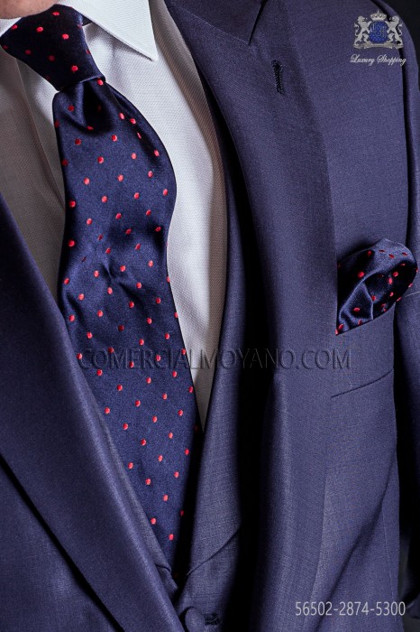Navy blue tie with red polka dots and matching pocket handkerchief