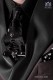 Narrow black fashion tie with skulls metal fixtures