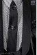 Narrow black fashion tie with black polka dots