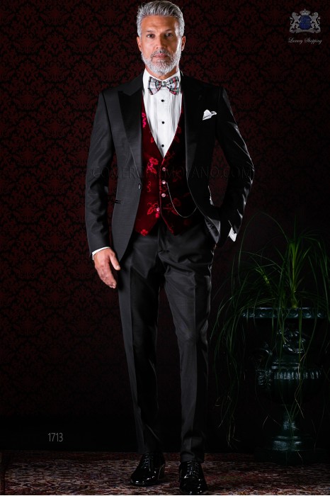 Italian bespoke black tuxedo with peak satin lapels and 1 button. Wool mix fabric.