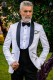 Bespoke black and white silk dinner jacket combined with a black trousers