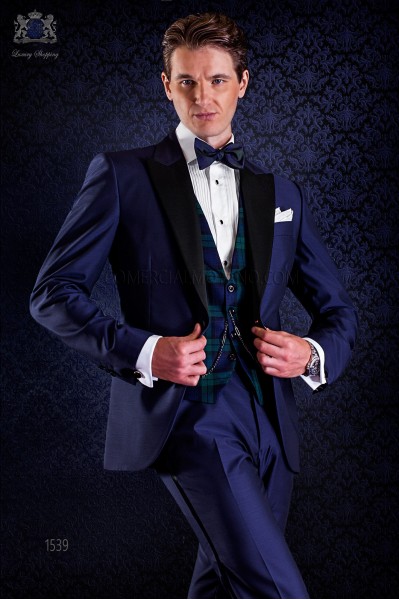 bespoke blue tuxedo with peak satin lapels and 1 button. Wool mix fabric.