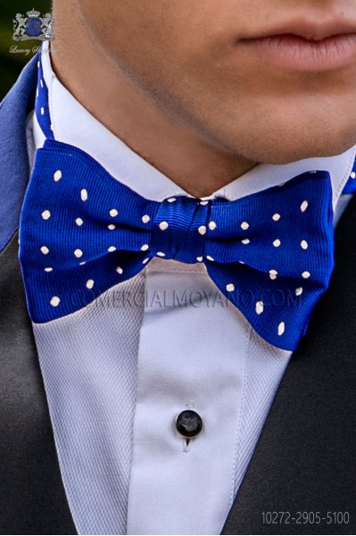 Royal blue bow tie with white polka dots