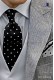 Corbata negra de seda con topos blancos