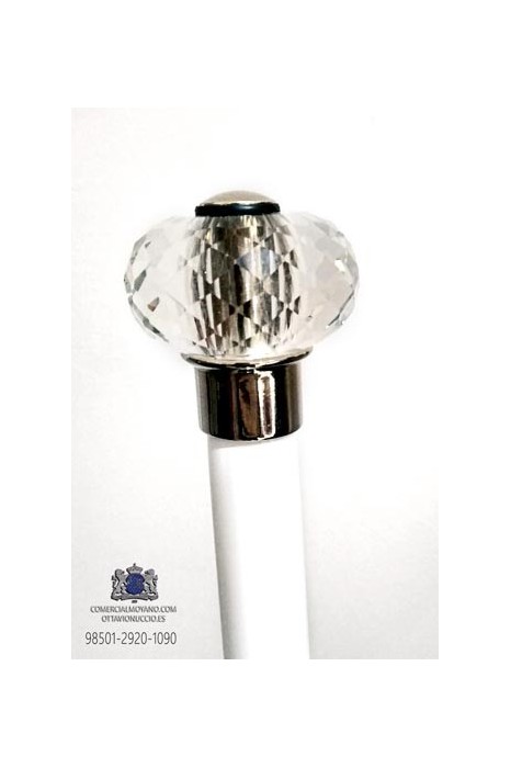 White cane with carved glass knob set in silver metal.